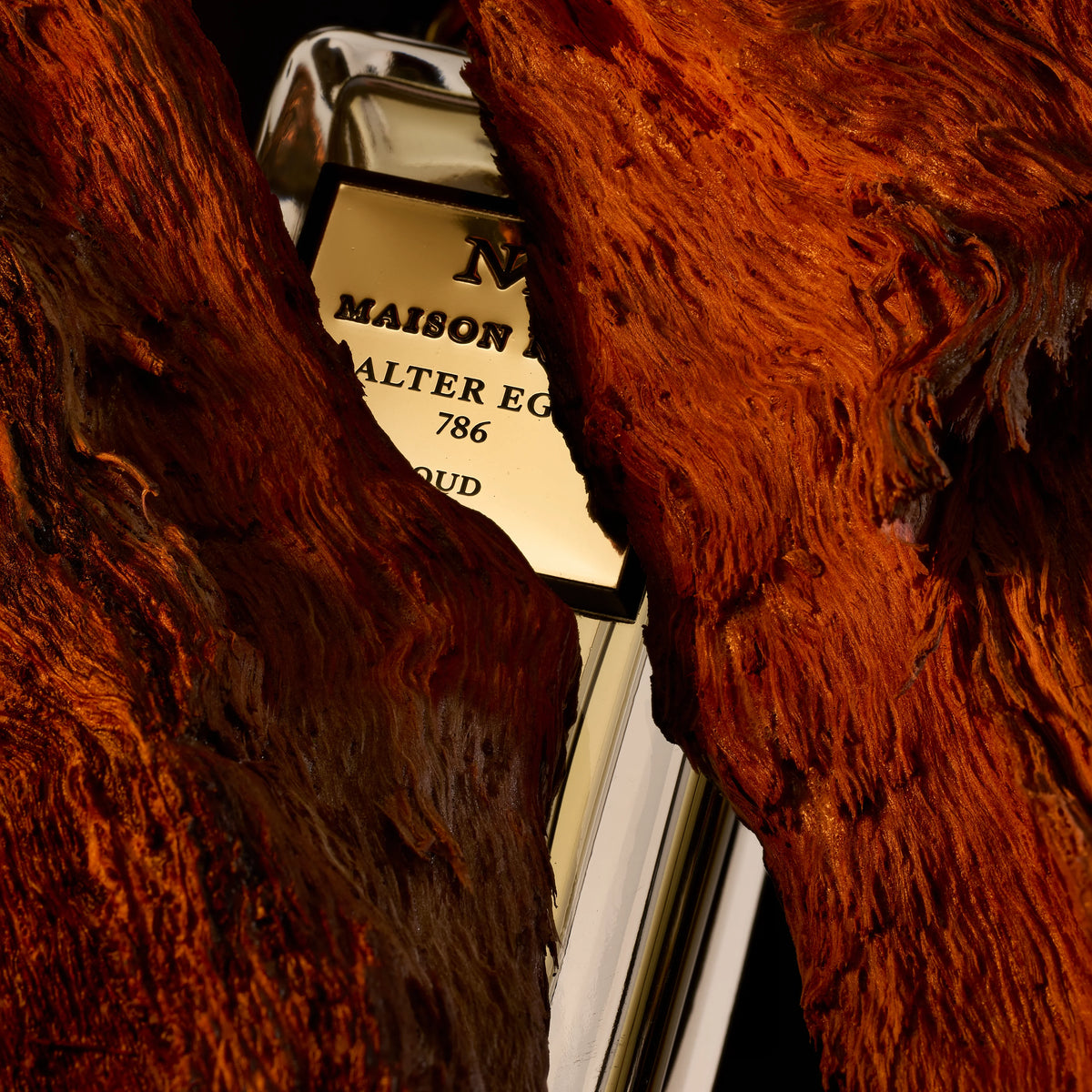 A flacon set into red rock, lit close and warm